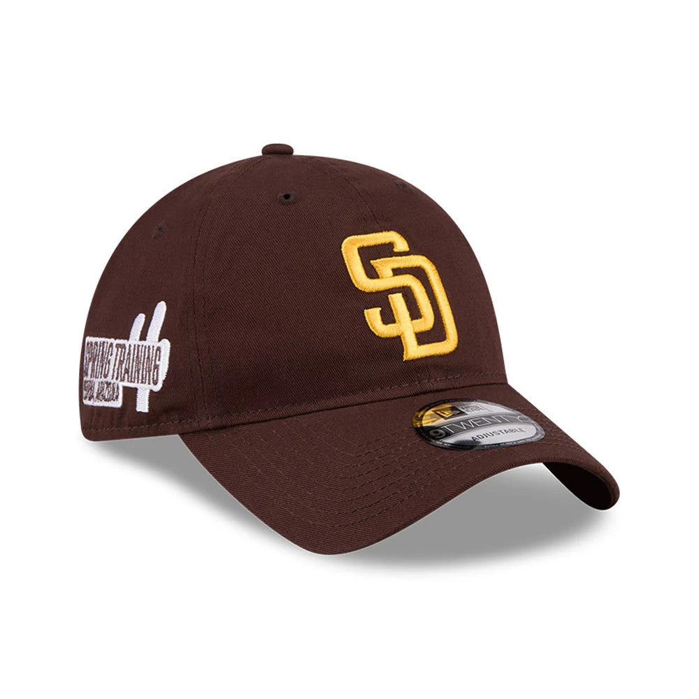 San Diego Padres MLB Colours Dark Brown New Era 9TWENTY Adjustable Cap, three-quarter view showing the raised yellow SD logo on the front panel, a curved visor with a 9TWENTY size sticker, and Spring Training patch on the side.