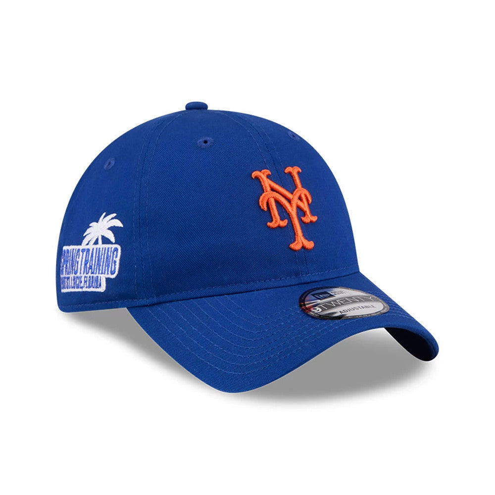 New York Mets MLB Colours Blue New Era 9TWENTY Adjustable Cap, three-quarter view showing the orange embroidered NY logo on the front panel, curved visor with a 9TWENTY size sticker, and Spring Training graphic on the side.