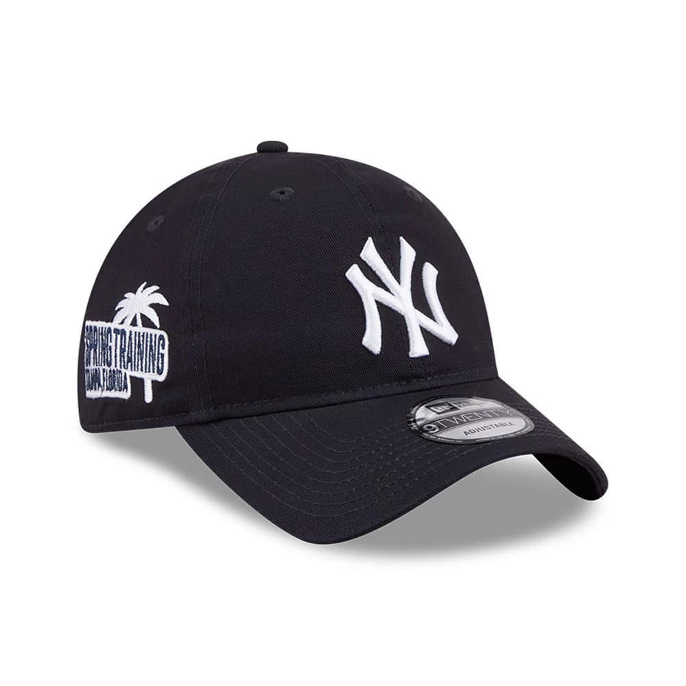 Yankees MLB Colours Navy New Era 9TWENTY Adjustable Cap, three-quarter view showing the white raised embroidered NY logo on the front panel, with an embroidered Spring Training Florida graphic on the right side.
