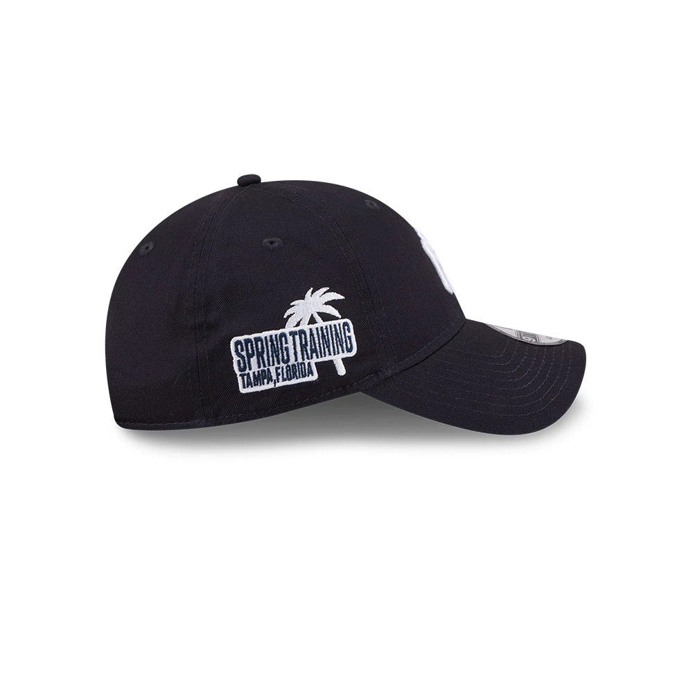 Yankees MLB Colours Navy New Era 9TWENTY Adjustable Cap, side view showing a white embroidered Spring Training Tampa, Florida graphic on the lower left panel, navy curved visor, and grey 9TWENTY size sticker.