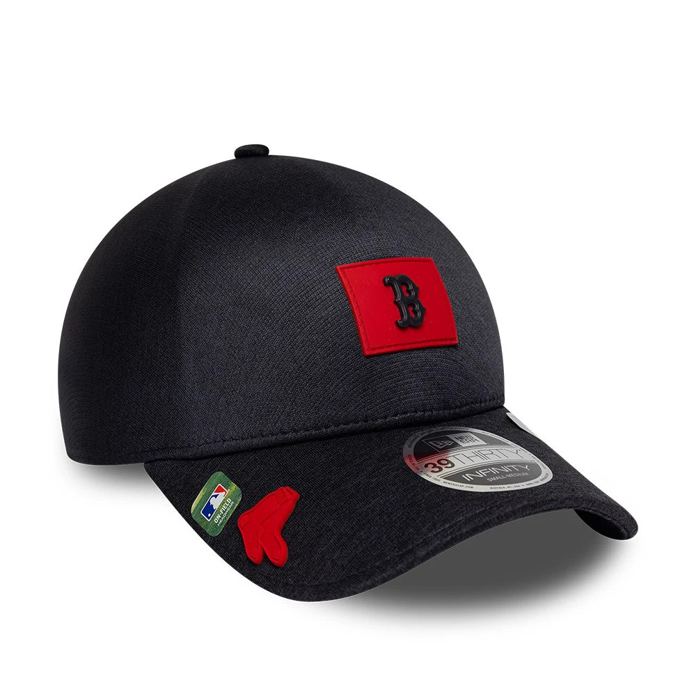 Boston Red Sox MLB Clubhouse Navy New Era 39THIRTY Infinity Stretch Fit Cap, three-quarter view showing a red B logo patch on the front panel, a 39THIRTY size sticker on the black curved visor, and an MLB logo patch on the left side.