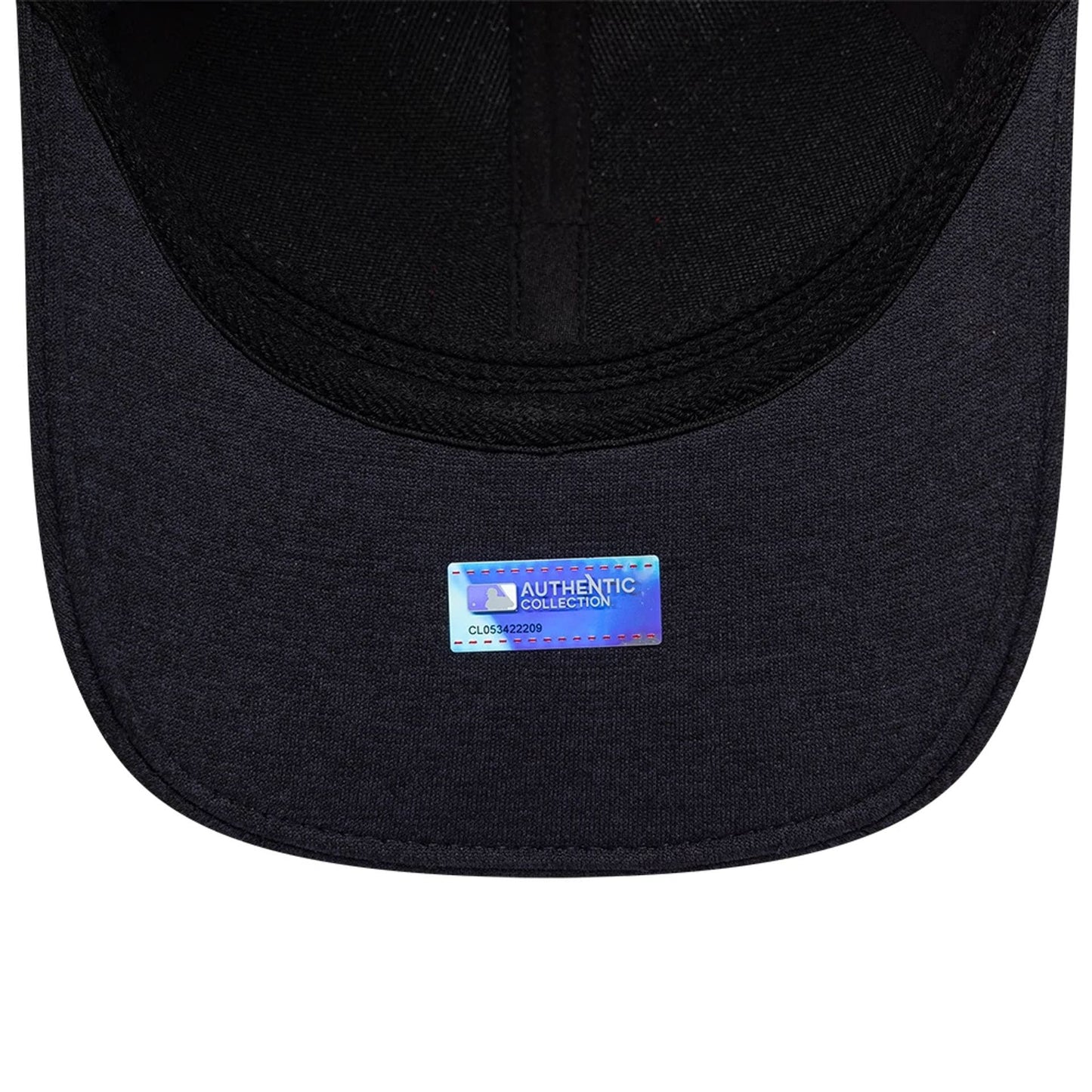 Minnesota Twins MLB Clubhouse Navy New Era 39THIRTY Infinity Stretch Fit Cap, inside view showing the navy undervisor with an Authentic Collection holographic sticker and black interior taping along the crown seams.
