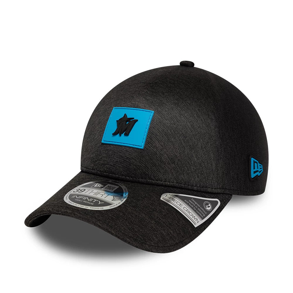 Miami Marlins MLB Clubhouse Black New Era 39THIRTY Infinity Stretch Fit Cap, three-quarter view showing the raised black Marlins logo on a blue patch on the front panel, with a 39THIRTY size sticker on the curved black visor.