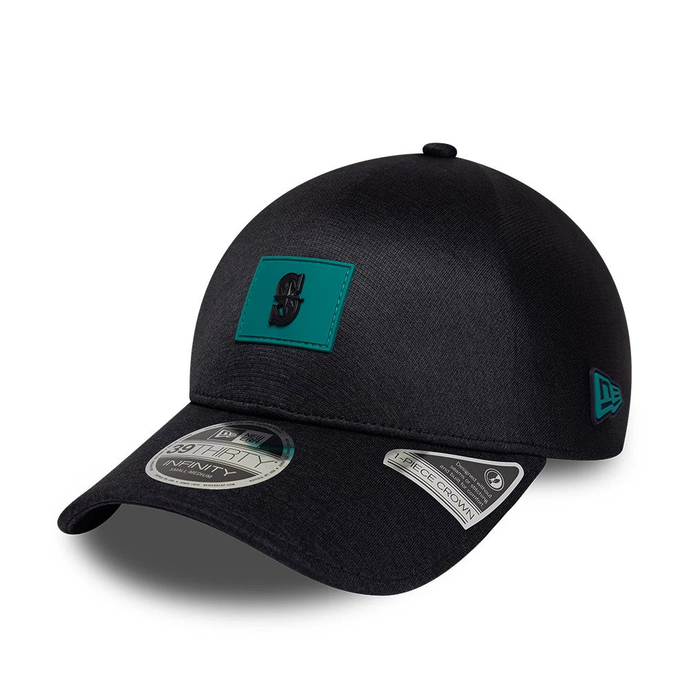Seattle Mariners MLB Clubhouse Navy New Era 39THIRTY Infinity Stretch Fit Cap, three-quarter view showing the teal patch with a raised logo on the front panel, curved visor with two size stickers, and teal New Era flag logo on the left side.