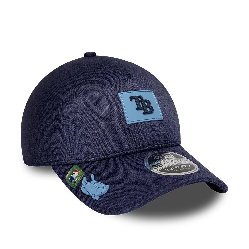 Tampa Bay Rays MLB Clubhouse Navy New Era 39THIRTY Infinity Stretch Fit Cap, three-quarter view showing the raised navy TB logo on a light blue patch, a 39THIRTY size sticker on the navy curved visor and an MLB logo on the left side.