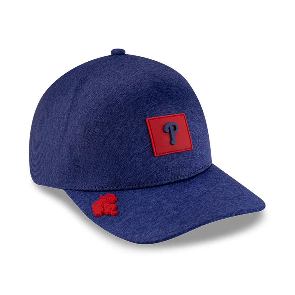 Philadelphia Phillies MLB Clubhouse Red New Era 39THIRTY Infinity Stretch Fit Cap, three-quarter view showing the raised red rectangular badge with a navy blue P on the front panel and a red embroidered mascot on the visor.