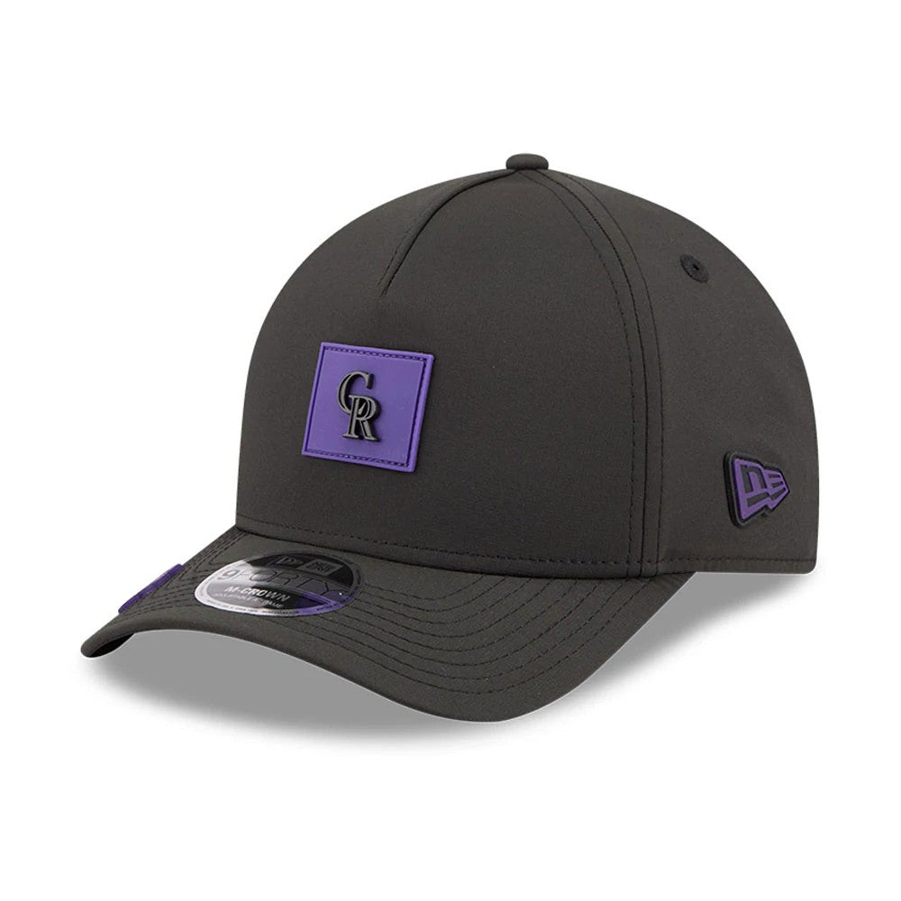 Colorado Rockies MLB Clubhouse Black New Era 9FORTY M-Crown A-Frame Adjustable Cap, three-quarter view showing the raised purple and black CR logo centred on the front, black curved visor with 9FORTY size sticker.