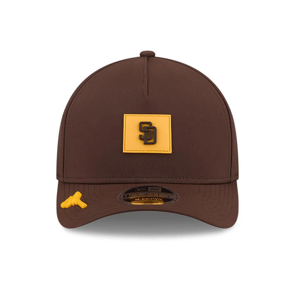 San Diego Padres MLB Clubhouse Dark Brown New Era 9FORTY M-Crown A-Frame Adjustable Cap, front view showing the SD logo in black on a yellow square patch, a brown curved visor with a 9FORTY size sticker, and a gold T logo on the left side.