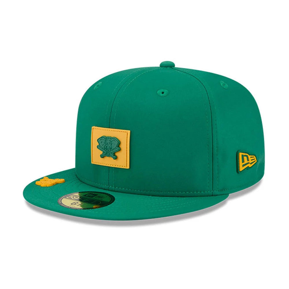 Athletics MLB Clubhouse Dark Green New Era 59FIFTY Fitted Cap, front three-quarter view showing a yellow patch logo on the green front panel, a gold 59FIFTY size sticker on the dark green visor, and a yellow New Era flag logo on the left side.
