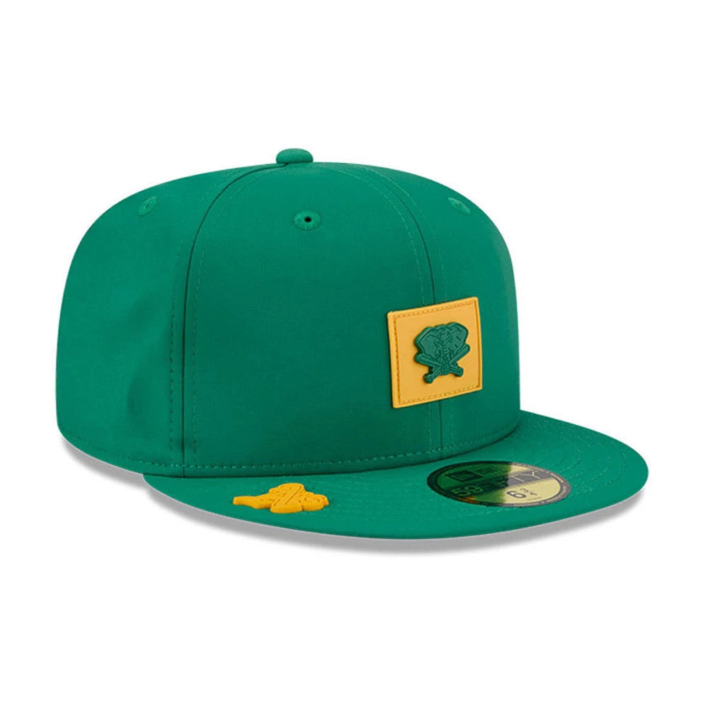Athletics MLB Clubhouse Dark Green New Era 59FIFTY Fitted Cap, three-quarter view showing a dark green embroidered logo on a yellow patch at the front panel, a matching yellow detail on the visor, and a gold 59FIFTY size sticker.