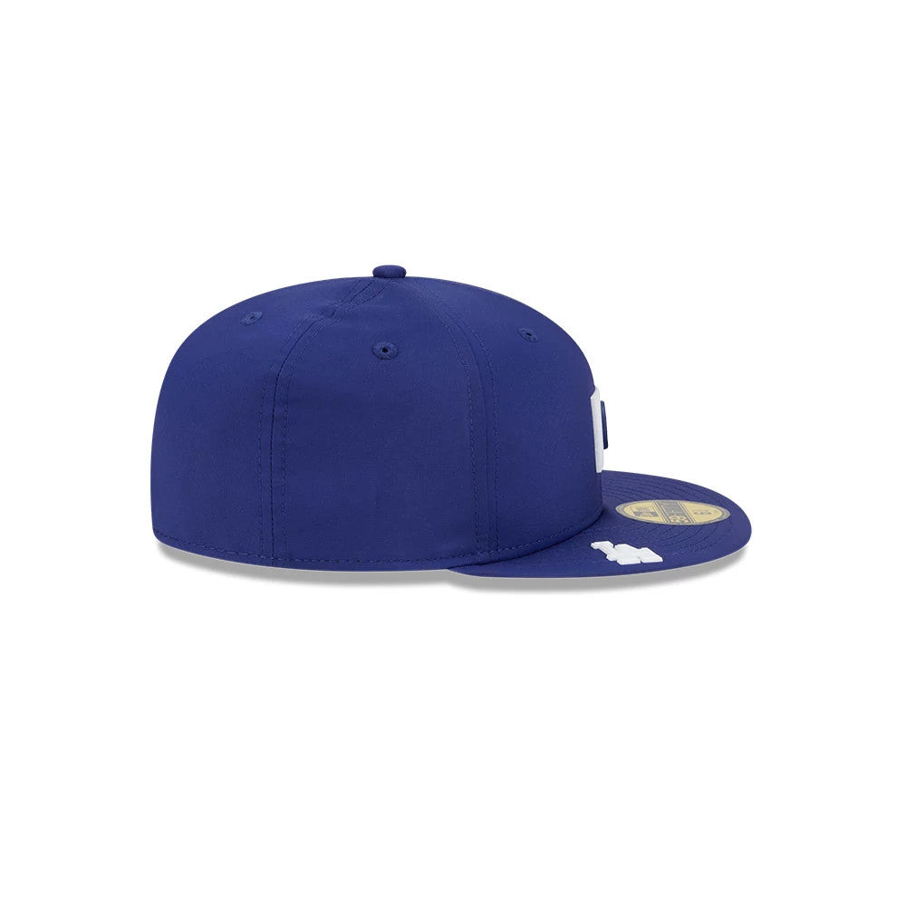 LA Dodgers MLB Clubhouse Dark Blue New Era 59FIFTY Fitted Cap, side view showing the structured dark blue crown, a white New Era flag logo on the left side, and a gold 59FIFTY size sticker on the flat visor.