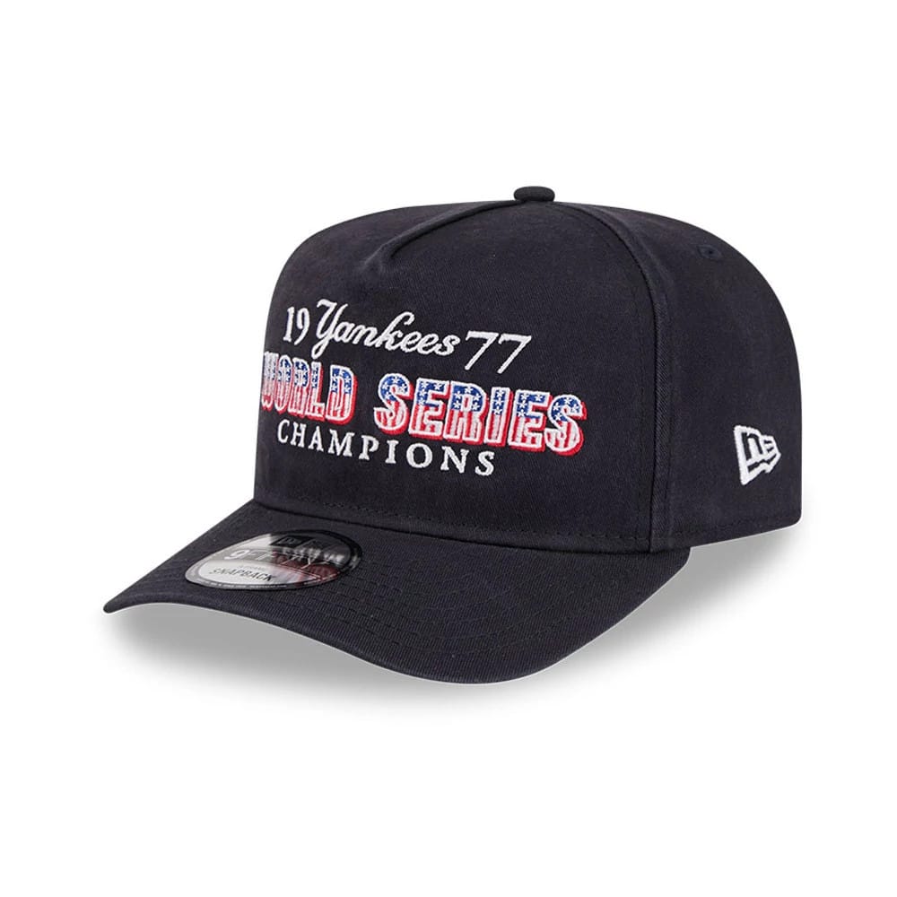 New York Yankees MLB Historic Navy New Era 9FIFTY A-Frame Snapback Adjustable Cap, three-quarter view with white and patterned World Series Champions and 1977 Yankees embroidered on the front panel, flat navy visor and 9FIFTY size sticker.