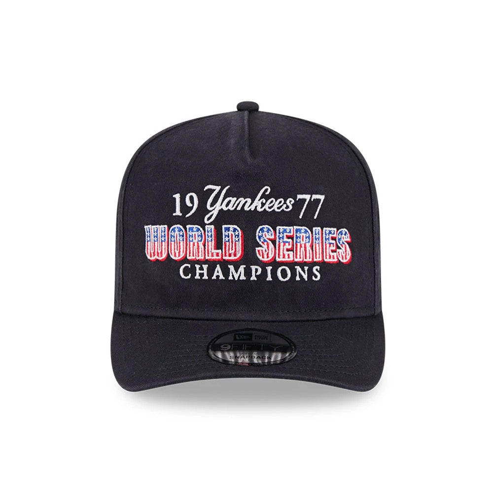 New York Yankees MLB Historic Navy New Era 9FIFTY A-Frame Snapback Adjustable Cap, front view showing raised embroidered text reading 19 Yankees 77 World Series Champions in red, white, and blue above a navy visor with a 9FIFTY size sticker.
