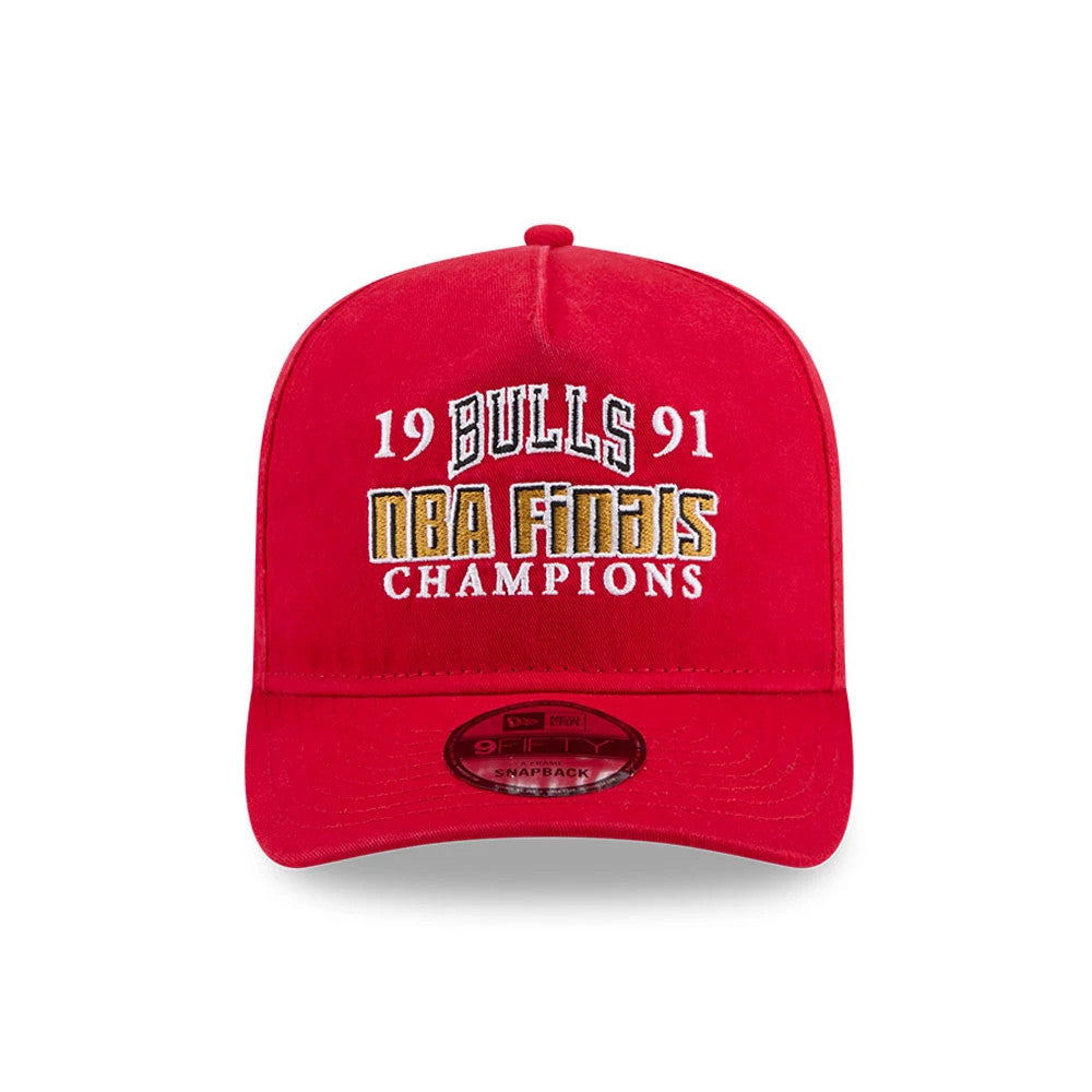 Chicago Bulls NBA Historic Red New Era 9FIFTY A-Frame Snapback Adjustable Cap, front view showing white and gold embroidered 1991 NBA Finals Champions lettering on the structured red crown and a 9FIFTY size sticker on the red visor.