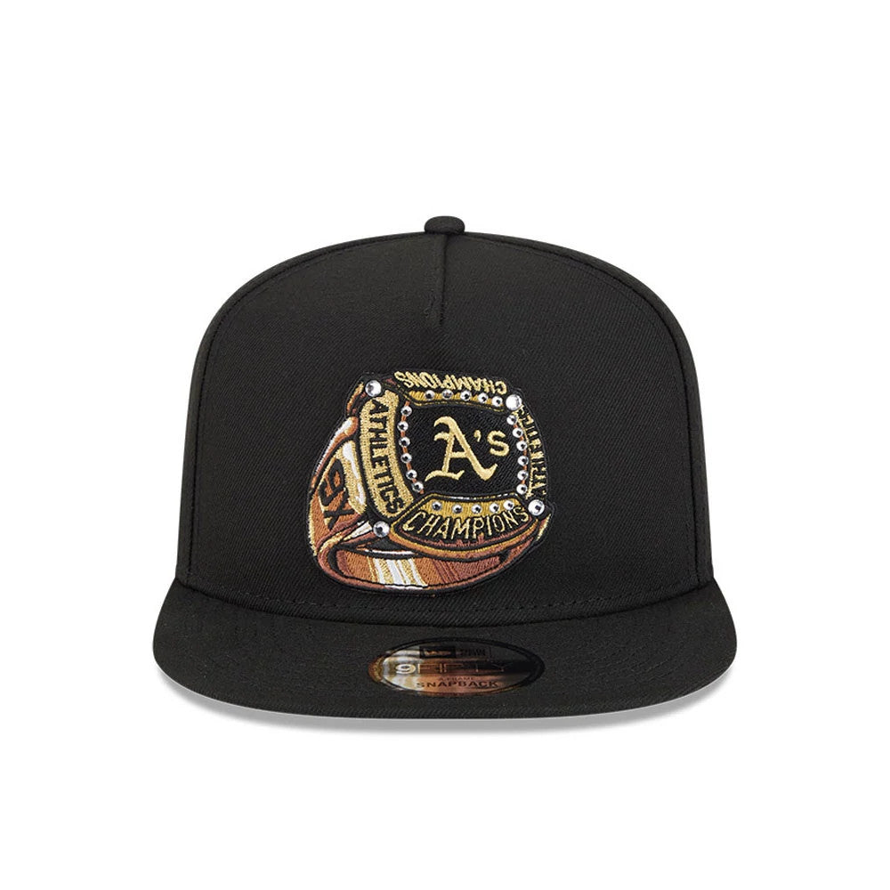 Athletics MLB Ring Black New Era 9FIFTY A-Frame Snapback Adjustable Cap, front view showing the detailed gold embroidered championship ring graphic on the structured black crown, with a black flat visor and 9FIFTY size sticker.