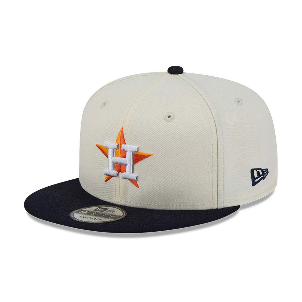 Houston Astros MLB Localized White New Era 9FIFTY Snapback Adjustable Cap, three-quarter view with an orange and white embroidered logo on the front panel, a navy flat visor with a 9FIFTY size sticker, and New Era flag logo on the left side.