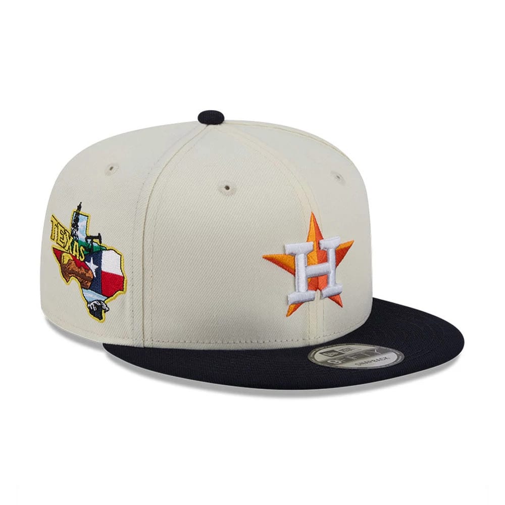 Houston Astros MLB Localized White New Era 9FIFTY Snapback Adjustable Cap, three-quarter view showing the orange and white H logo with star embroidery on the front panel, a navy flat visor, and the Texas graphic on the side.