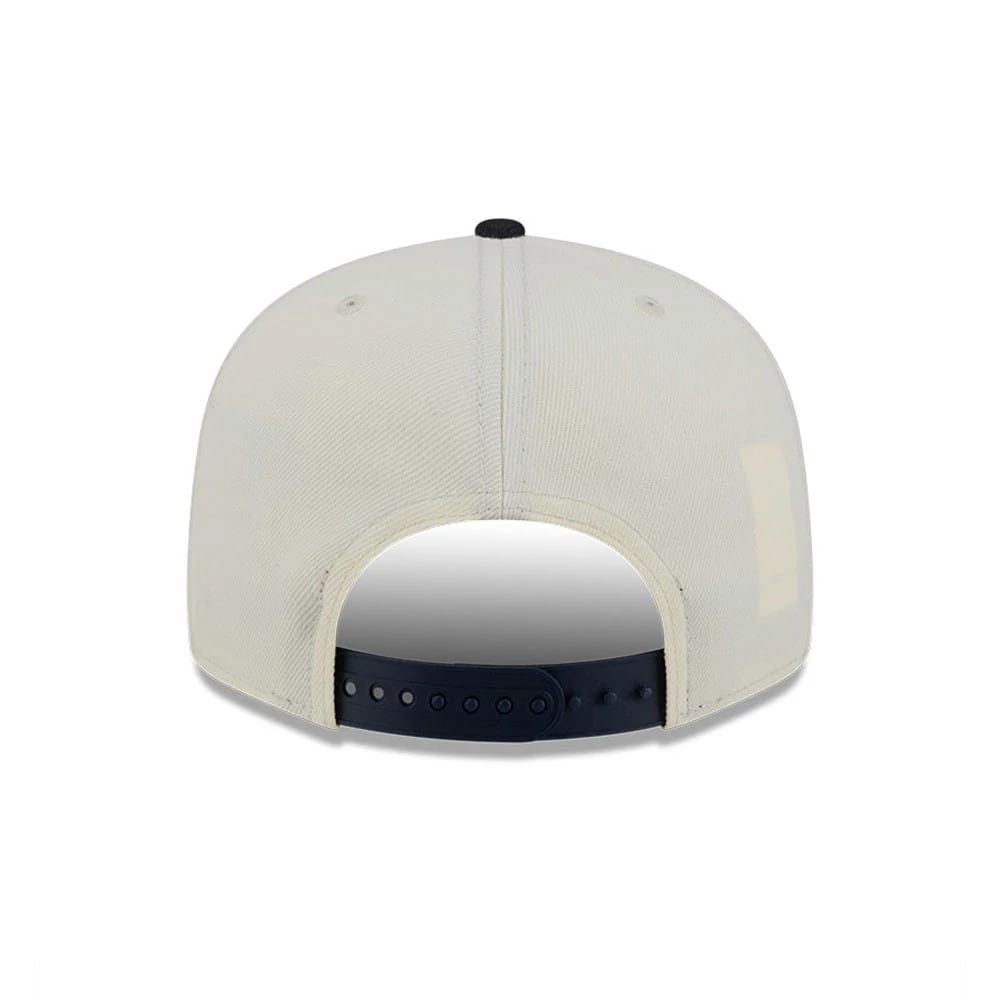 Atlanta Braves MLB Localized White New Era 9FIFTY Snapback Adjustable Cap, rear view showing the black adjustable snap closure and the cream-toned structured back panels with eyelets and a black top button.