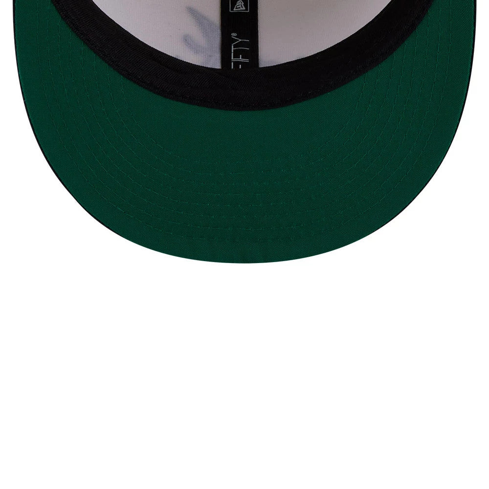 Atlanta Braves MLB Localized White New Era 9FIFTY Snapback Adjustable Cap, inside view showing the green undervisor, black sweatband, and black New Era branded taping across the inner crown.
