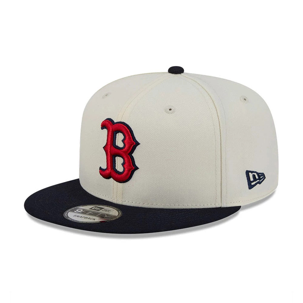 Boston Red Sox MLB Localized White New Era 9FIFTY Snapback Adjustable Cap, three-quarter view showing the red embroidered B logo on the front panel, navy flat visor with a 9FIFTY size sticker, and New Era flag logo on the left side.