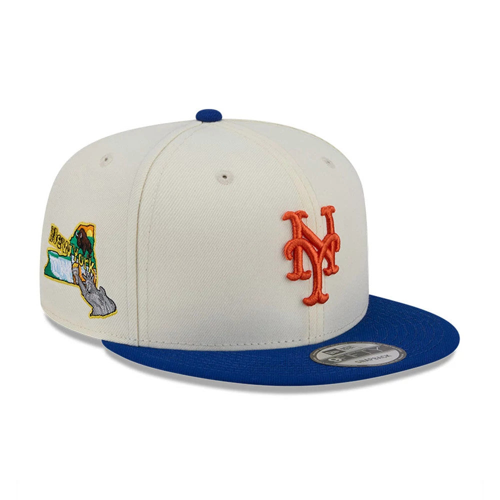 New York Mets MLB Localized White New Era 9FIFTY Snapback Adjustable Cap, front view showing the orange Mets logo embroidered on the front panel, with a blue flat visor and a 9FIFTY size sticker, plus a colourful map graphic on the side.