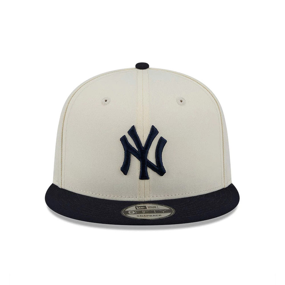 New York Yankees MLB Localized White New Era 9FIFTY Snapback Adjustable Cap, front view with a raised navy NY logo on the white front panel, a navy flat visor, and a 9FIFTY size sticker on the visor.