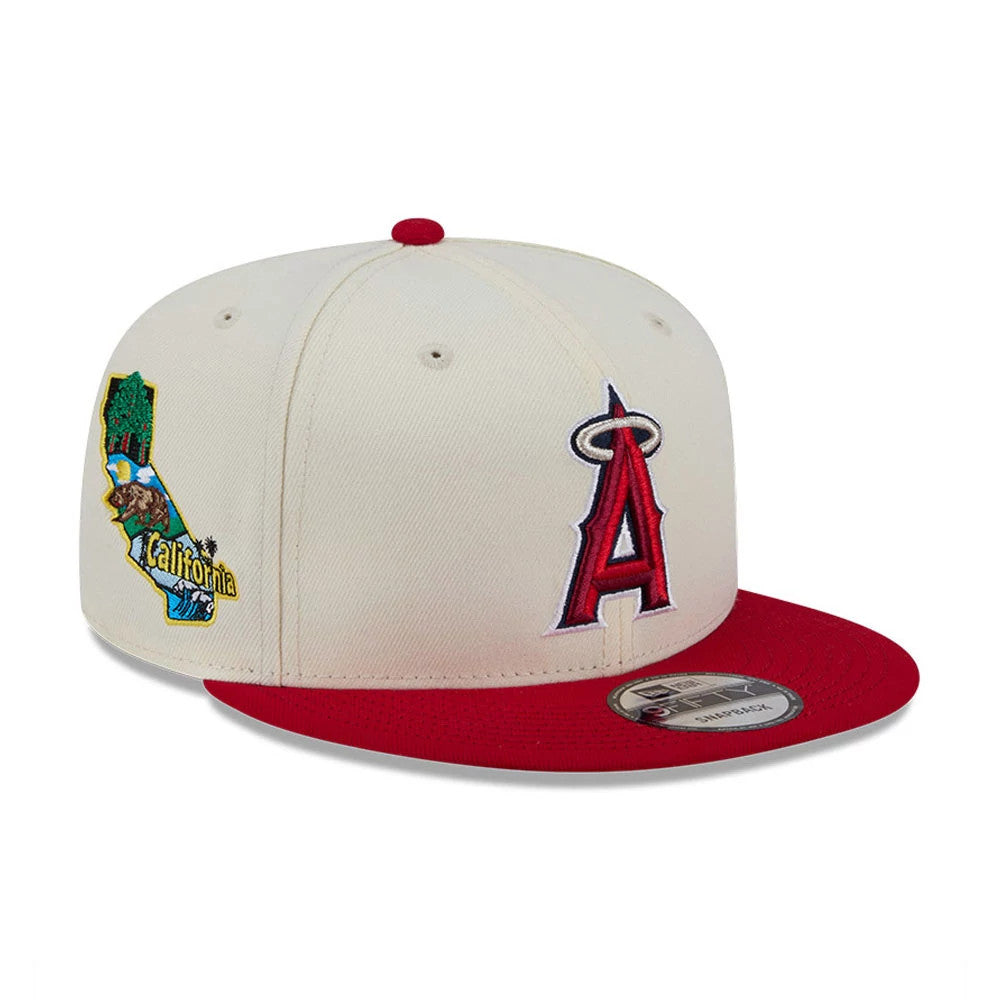 Pictured is this MLB Localized LA Angels 9FIFTY Snapback cap in white. 1
