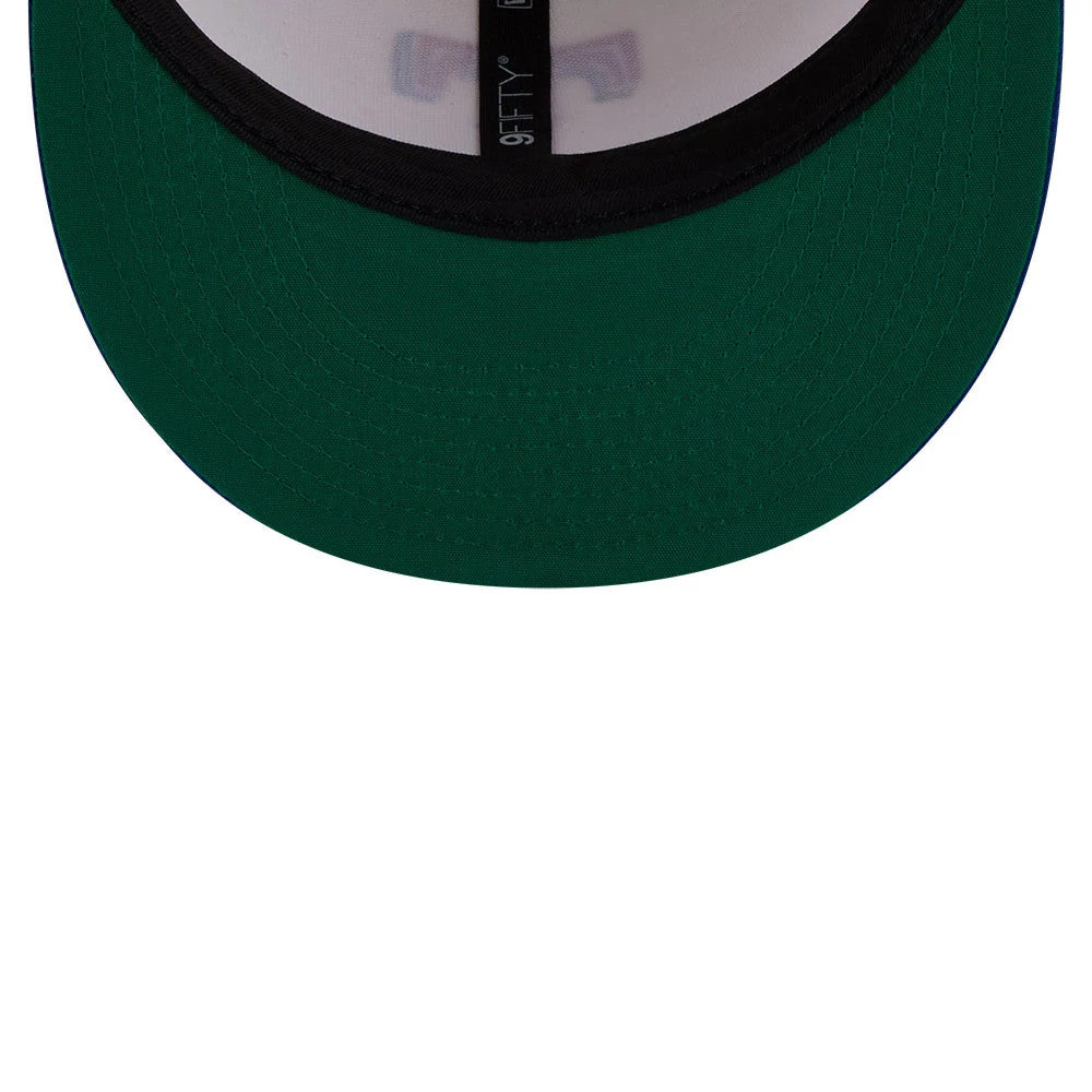 Texas Rangers MLB Localized White New Era 9FIFTY Snapback Adjustable Cap, inside view showing a green undervisor, black taping featuring the 9FIFTY logo, and a white sweatband encircling the cap's interior.
