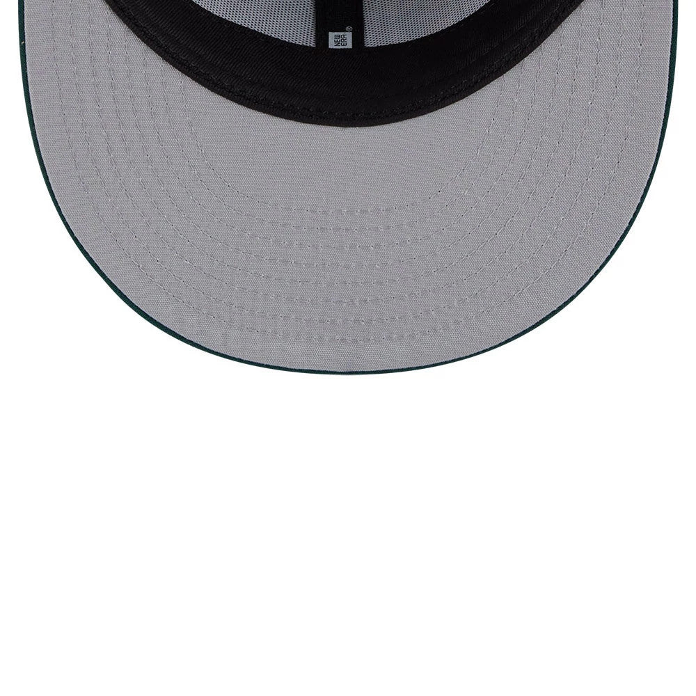 Athletics MLB Leaves Dark Green New Era 59FIFTY Fitted Cap, inside view showing the grey undervisor, black sweatband and branded taping, with a detailed close-up of the cap's structured interior lining.