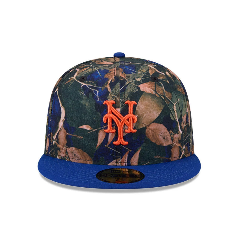 New York Mets MLB Leaves Blue New Era 59FIFTY Fitted Cap, front view showing an orange embroidered Mets logo centred on a leaf-patterned crown, with a contrasting blue flat visor and gold 59FIFTY size sticker.