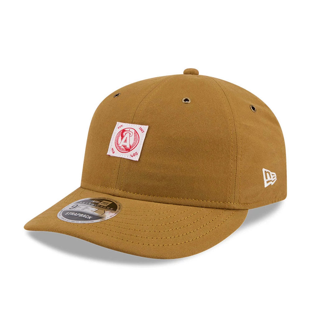 LA Angels MLB Brushed Dark Beige Retro Crown New Era 9FIFTY Adjustable Cap, three-quarter view showing a red and white A logo patch on the front panel, curved visor with 9FIFTY size sticker, and New Era flag logo on the left side.