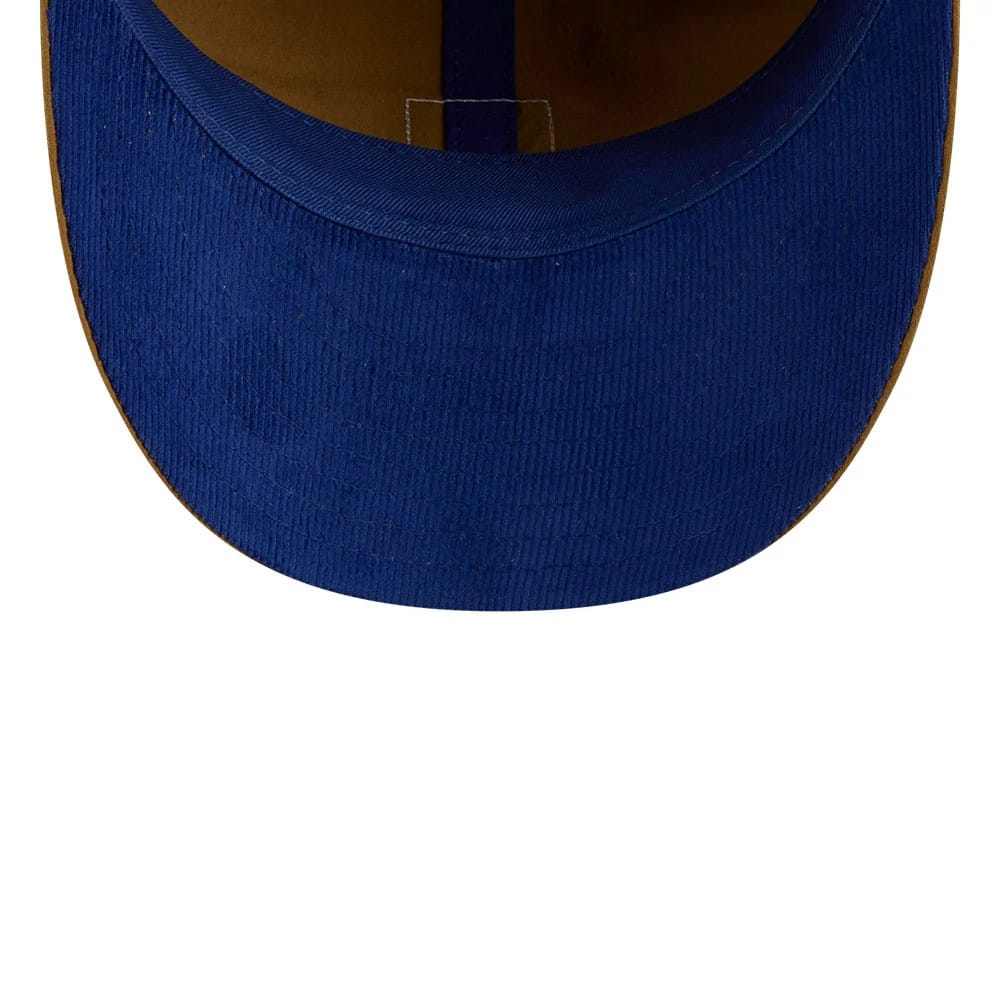 New York Mets MLB Brushed Dark Beige Retro Crown New Era 9FIFTY Adjustable Cap, inside view showing the dark blue undervisor, brown sweatband and inner seam taping, with a focus on the stitching details around the visor.