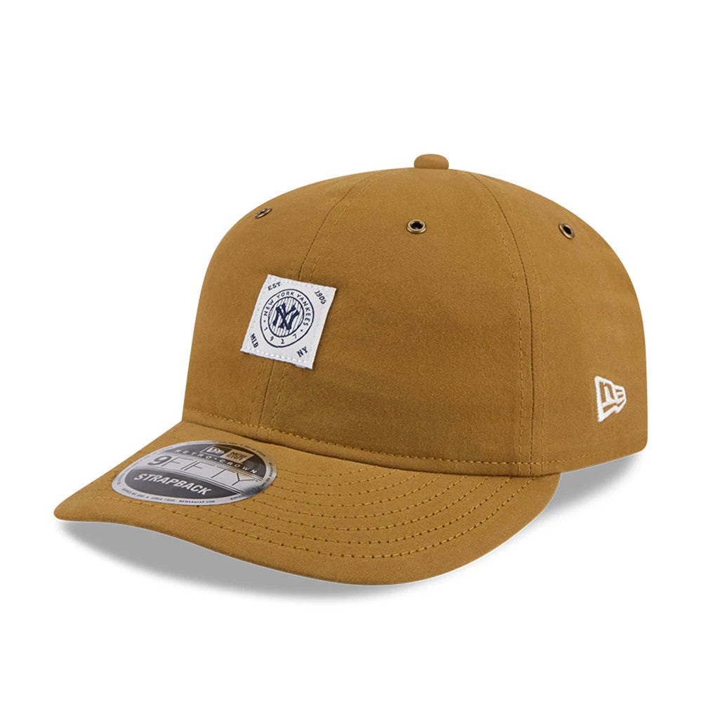 New York Yankees MLB Brushed Dark Beige Retro Crown New Era 9FIFTY Adjustable Cap, front view showing a white woven patch with team logo on the front panel, a curved visor with 9FIFTY size sticker, and New Era flag logo on the left side.