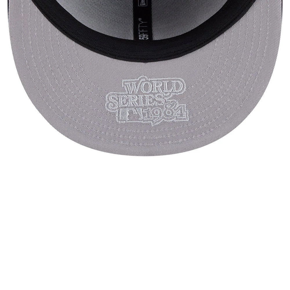 Detroit Tigers MLB Hidden Hit Navy New Era 59FIFTY Fitted Cap, inside view showing grey undervisor with white embroidered World Series 1984 text, black sweatband, and 59FIFTY taping along the centre.