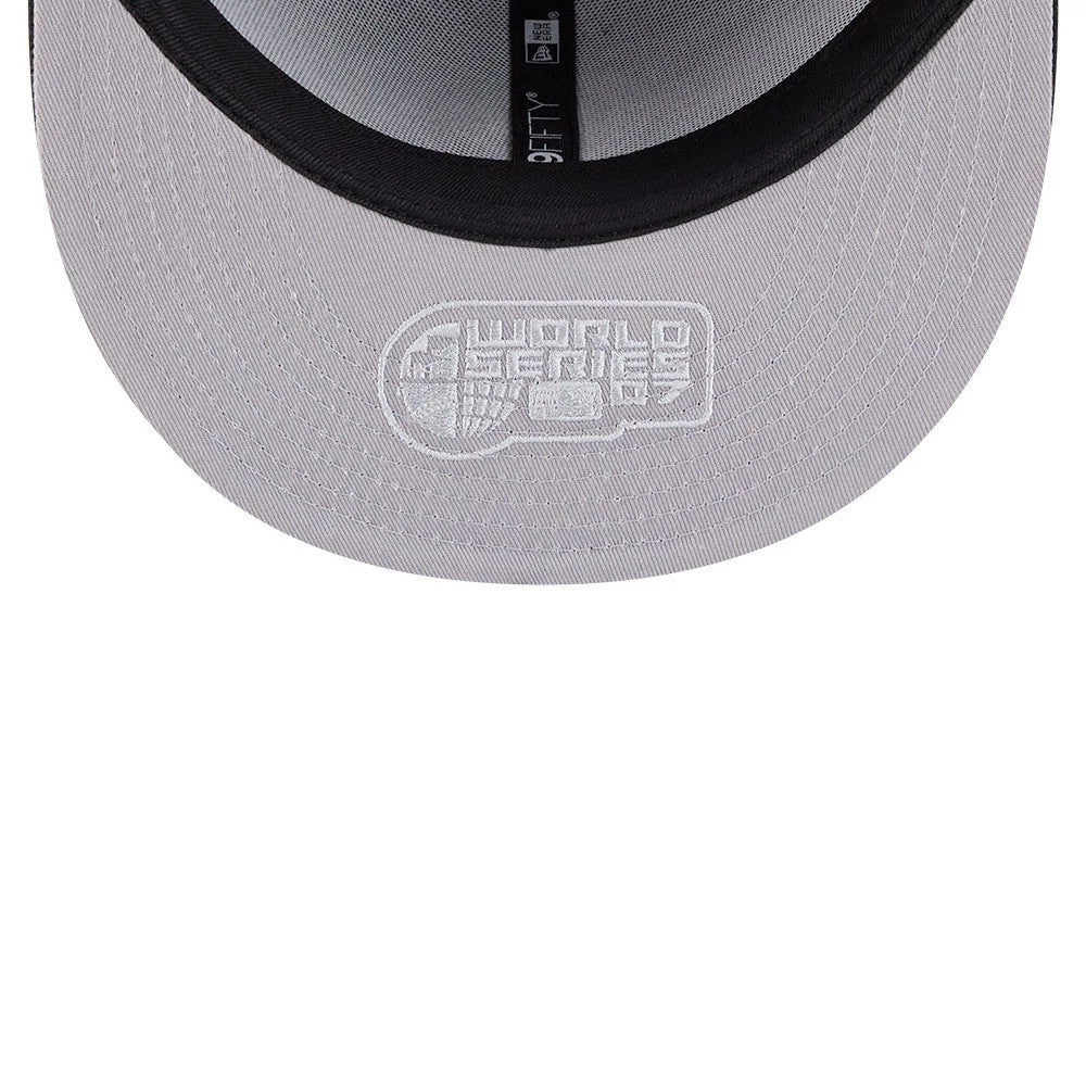 Colorado Rockies MLB Hidden Hit Black New Era 59FIFTY Fitted Cap, inside view showing grey undervisor with white World Series graphic, black sweatband, and New Era taping across the interior crown.