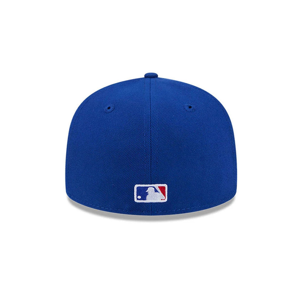 Chicago Cubs MLB Hidden Hit Blue New Era 59FIFTY Fitted Cap, rear view showing the embroidered MLB Batterman logo in blue, white, and red at the centre back, with a matching blue structured crown and top button.