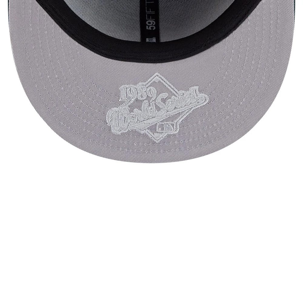 Pictured is this MLB Hidden Hit Athletics 59FIFTY Fitted cap in dark green. 2