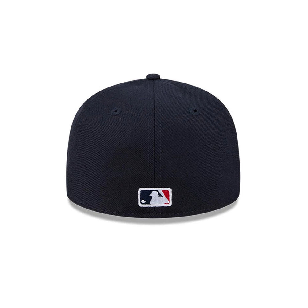 Atlanta Braves MLB Hidden Hit Navy New Era 59FIFTY Fitted Cap, rear view showing the white and red embroidered MLB Batterman logo at the centre of the navy back panels, with matching navy eyelets and a top button.