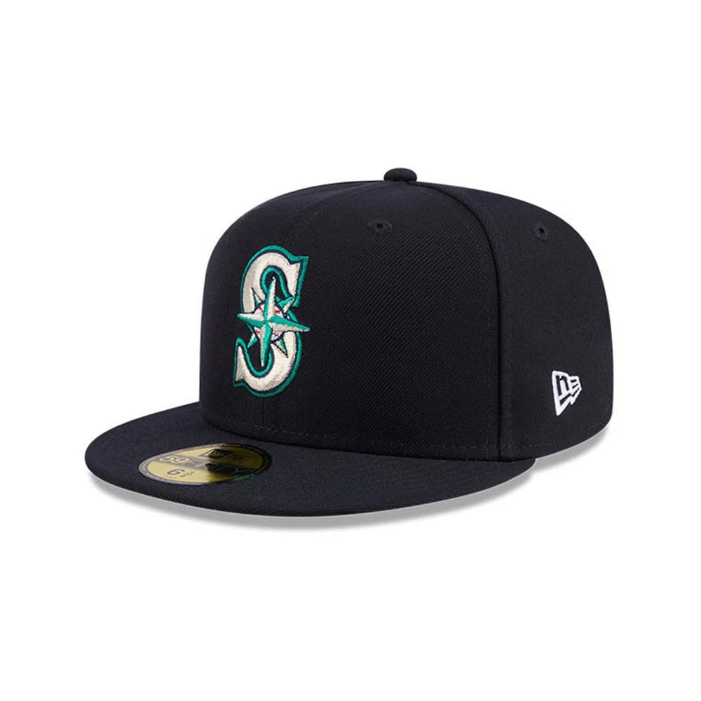 Seattle Mariners MLB Hidden Hit Navy New Era 59FIFTY Fitted Cap, three-quarter view showing the raised teal and white embroidered Mariners logo on the front panel, navy visor with a gold 59FIFTY size sticker.