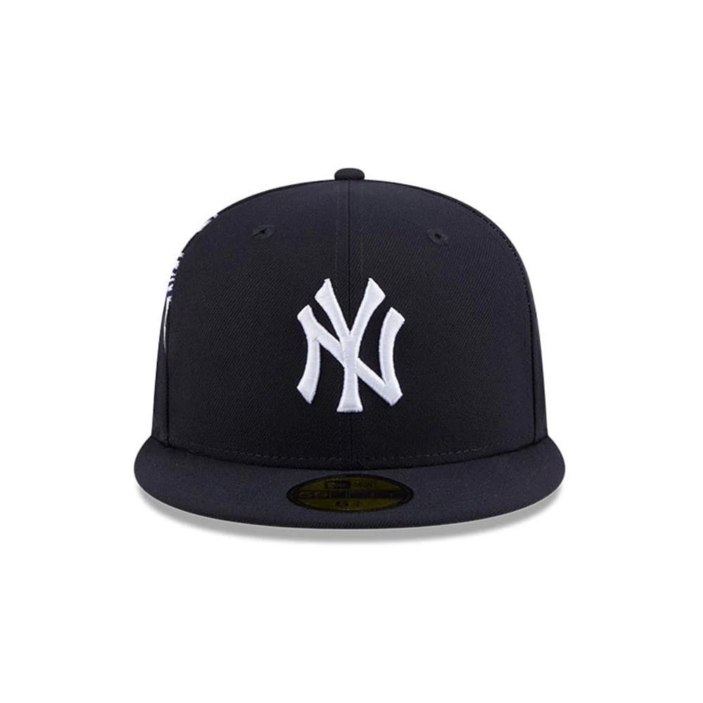 New York Yankees MLB Hidden Hit Navy New Era 59FIFTY Fitted Cap, front view showing the white raised embroidered NY logo on the structured navy crown, with a dark navy flat visor and a gold 59FIFTY size sticker on the visor.