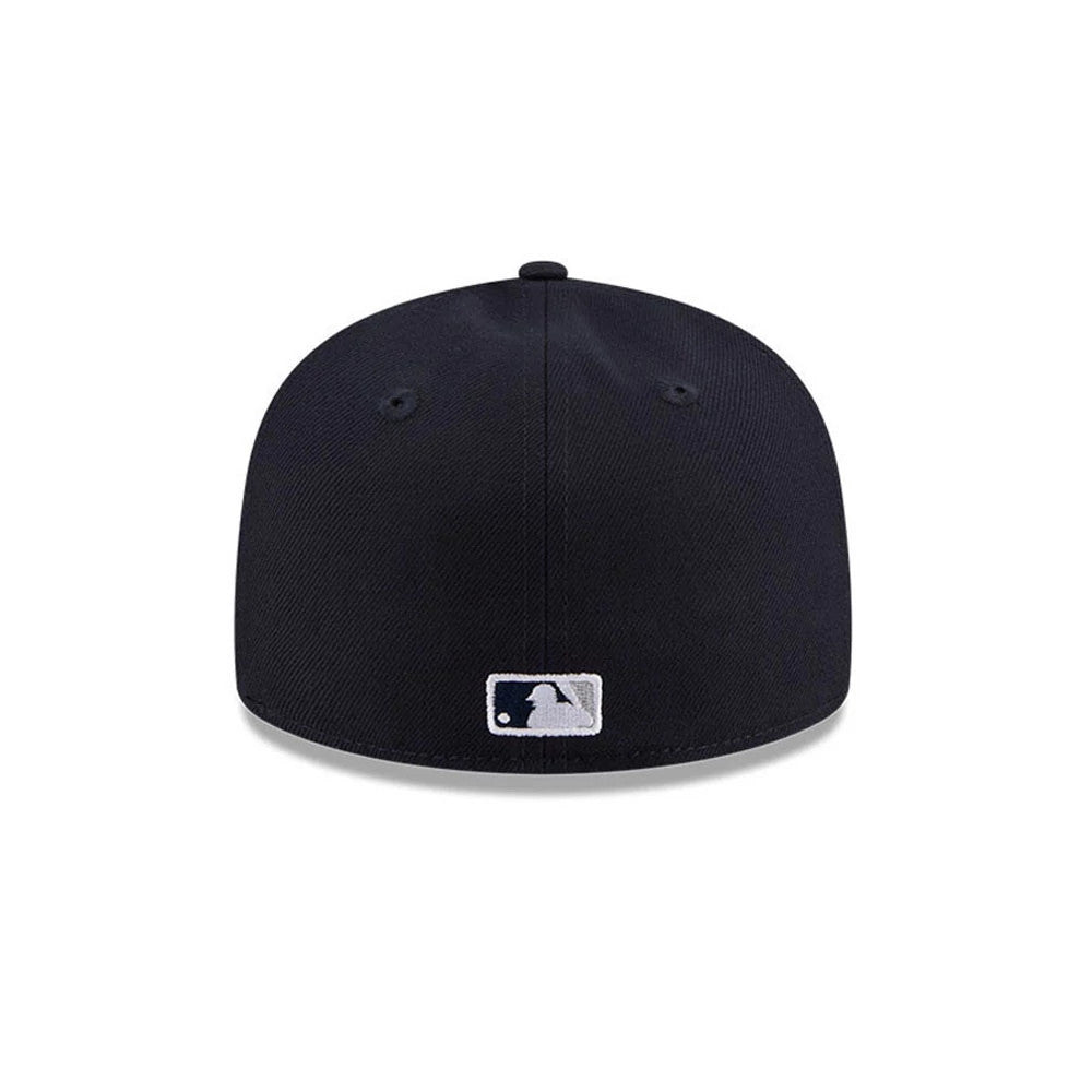 New York Yankees MLB Hidden Hit Navy New Era 59FIFTY Fitted Cap, rear view showing the white embroidered MLB Batterman logo at the centre back above the bottom edge of the structured navy crown.