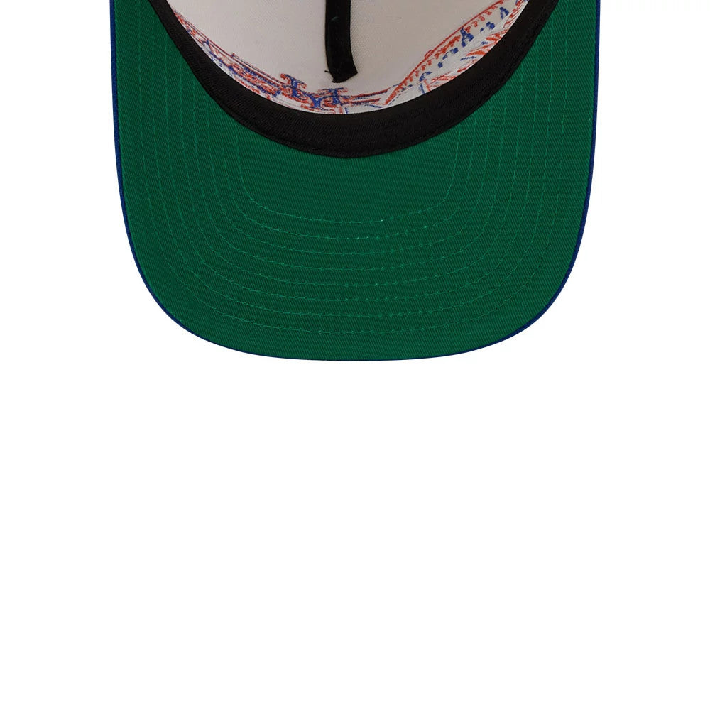 New York Mets MLB Classic Cream New Era 9FIFTY A-Frame Snapback Adjustable Cap, inside view showing a green undervisor, black sweatband, and colourful interior taping with Mets-themed graphics.