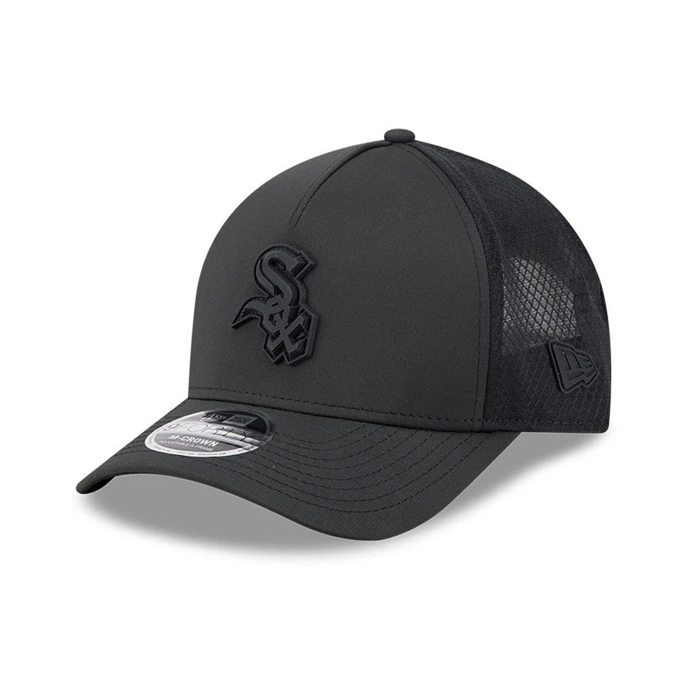Chicago White Sox MLB Badged Black New Era 9FORTY M-Crown A-Frame Trucker Cap, three-quarter view showing raised black 'Sox' embroidery on the front panel, black curved visor with 9FORTY size sticker and black mesh back panels.