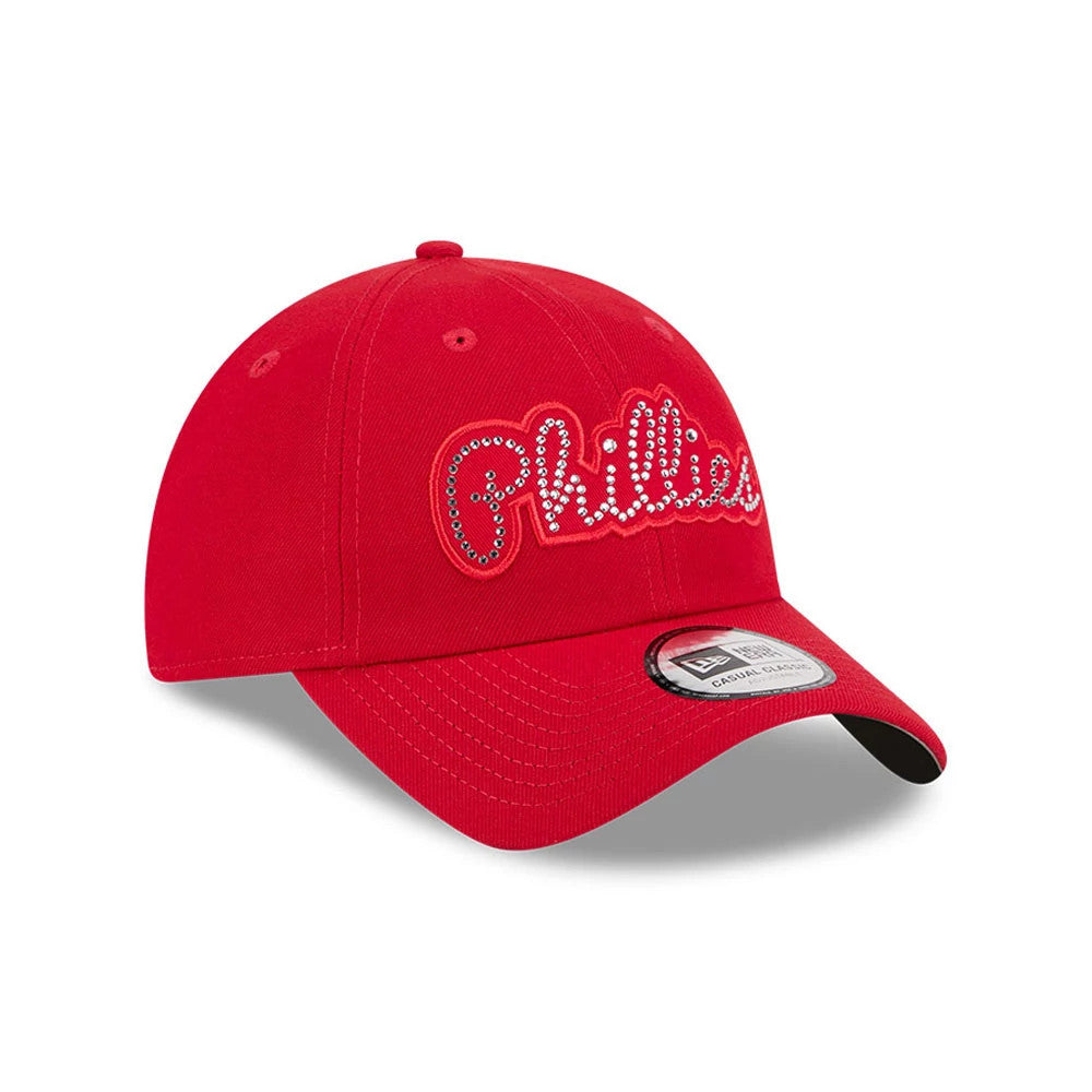 New Era Philadelphia Phillies MLB Rhinestone Red Casual Classic Adjustable Cap, three-quarter view showing the Phillies script logo embellished with rhinestones on the front panel, a curved red visor and a New Era patch on the visor.