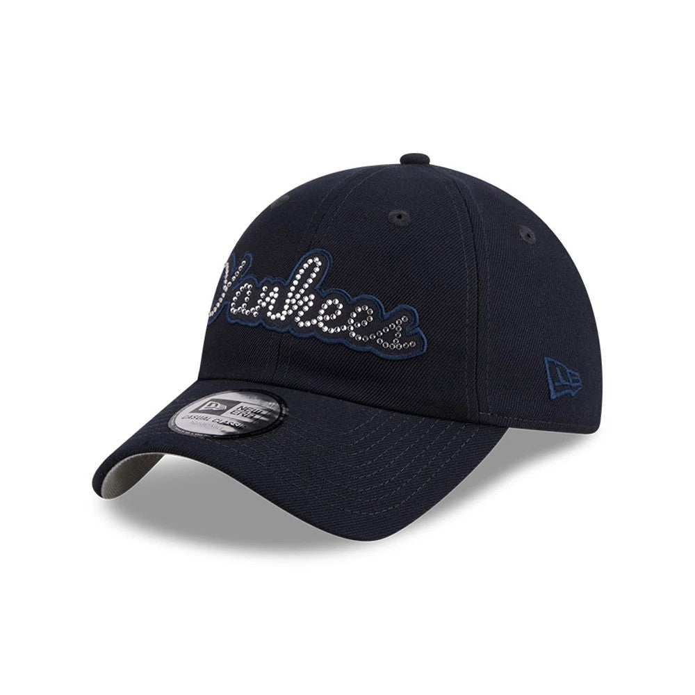 New York Yankees MLB Rhinestone Navy New Era Casual Classic Adjustable Cap, three-quarter view showing the Yankees logo in rhinestones on the front panel, with a black visor, grey undervisor, and New Era flag logo on the left side.