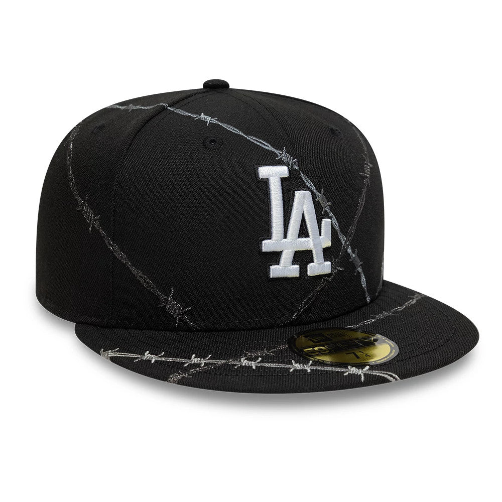 LA Dodgers MLB Wire Black New Era 59FIFTY Fitted Cap, three-quarter view showing the white raised LA logo on the front panel, black visor with grey barbed wire detail, and gold 59FIFTY size sticker on top.