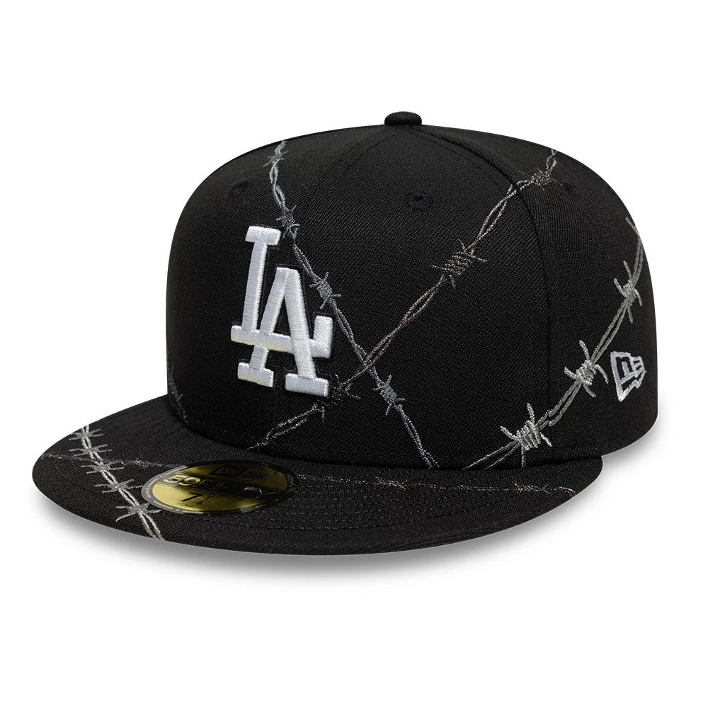 LA Dodgers MLB Wire Black New Era 59FIFTY Fitted Cap, three-quarter view showing the raised white LA logo on the front panel with barbed wire embroidery across the black crown and a gold 59FIFTY size sticker on the flat visor.