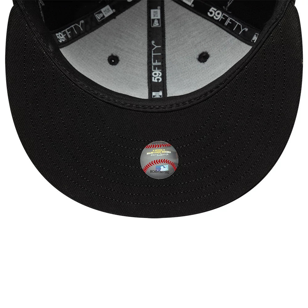 New York Yankees MLB Wire Black New Era 59FIFTY Fitted Cap, inside view showing the grey undervisor, MLB authentication sticker with red baseball stitching on the curved black visor, and black sweatband with white New Era and 59FIFTY branding.