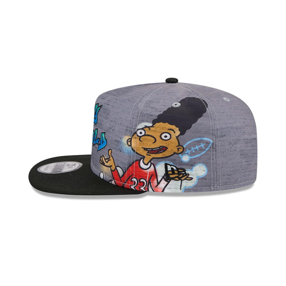 Hey Arnold Graffiti Grey New Era 9FIFTY A-Frame Snapback Adjustable Cap, side view showing colourful graffiti art and character graphics on the structured grey crown, with a black flat visor and a 9FIFTY size sticker.