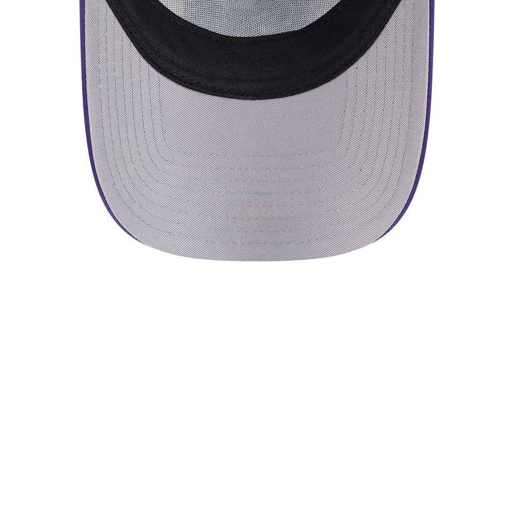 Power Puff Girls Black New Era 9FORTY A-Frame Trucker Adjustable Cap, inside view showing a black sweatband and grey undervisor, with purple stitching around the edge of the cap's visor.